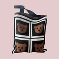 Detailed close-up of knitted fabric texture with brown bear pattern on a black tote bag - Black Bear