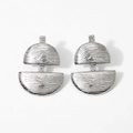 Macro detail of textured silver geometric earrings with abstract wave pattern design - Silver (PDE2554)