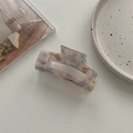 Macro detail of large acetate hair claw clip with colorful marble pattern and metal spring - Large Square Claw / Phantom Purple