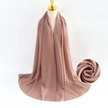 Elegant lotus pink pearl chiffon hijab scarf shown on a mannequin with texture detail - Lotus root pink