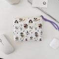 Floral quilted mini wallet with cute dog prints next to a white laptop and earbuds - Cartoon Dog