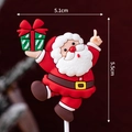 5.5cm Santa Claus cake topper figure holding green gift box for Christmas dessert decor - Soft Rubber 3D Santa Holding Gift Box