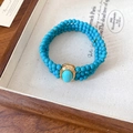 Close-up of vintage multi-layer turquoise bead bracelet with gold metal oval centerpiece - 59# Bracelet-Gold-Blue