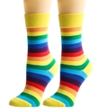 Detailed shot of rainbow striped crew socks with yellow ribbed cuffs on mannequin legs - One Size / Yellow Trim