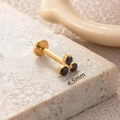 Gold F136 titanium labret stud featuring 4.5mm black zircon stones in a flower shape - 4.5mm / Gold-Black