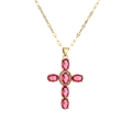 Goldene Kreuzkette mit rosa ovalen Edelsteinen und flacher Gliederkette auf Weiß - Schwarz