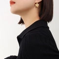 French vintage style gold-plated titanium steel flower earrings shown on a model's ear - F560-Gold Earrings Pair / Gold