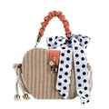 Beige woven straw crossbody bag with orange PU handle and black polka dot silk scarf - Orange