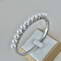 Silver stainless steel bangle with 10 white pearls in a sleek hinged design - Pearl Silver Bangle