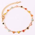 Detail of colorful enamel heart pendants on a gold chain anklet with extension - Multicolor Bracelet 2 (Dark & Bright Mix)