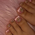 Pink press-on toe nails with golden bows and rhinestone floral accents on plush background - FW06 / Yellow Jelly Glue