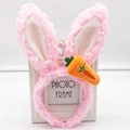 Plush pink bunny ears headband with cute carrot accessory shown on a white frame stand - Pink Rabbit Ears with Embroidered Carrot