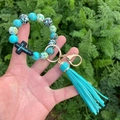 Leopard and turquoise silicone bead bracelet keychain with cross and green tassel - Green