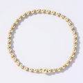 Handmade bohemian style gold beaded bracelet with a large central metal bead - Two-tone Gold