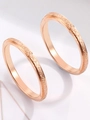 Detail showing two rose gold frosted rings on reflective white surface background - US 7 / Rose Gold