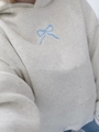 Detailed close-up of blue bow embroidery on a grey cotton hooded sweatshirt - XS / Tops / Blue Bow (Gray)