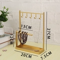 Golden iron jewelry display stand with necklace hooks and tray on wooden tabletop - 5 Hooks with Bracelet Bar / Gold