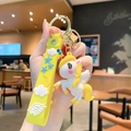 Simpatico portachiavi unicorno in silicone giallo con ali 3D e chiusura dorata lucida - Giallo