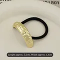 Elastic hair tie with a 5.2cm hammered gold metal plate and minimalist black band - Golden Pleated Single-row Arc