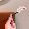 Wooden hair stick with pink floral charms and pearl tassel in elegant style - Rolling Pearl Wood