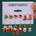 Christmas earring set with Santa, reindeer, and candy cane designs on dark green backdrop - 24 Gift Box Santa Reindeer (6 Pairs Set)