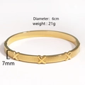 Macro detail of gold plated square bangle with crystal accents and 7mm width dimensions - Gold Embossed X-Shape Style (Style 1)