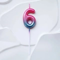 Number 6 birthday candle with pink to blue gradient finish and sparkling gold glitter - Pink Lake Blue Gradient Number 6 Candle
