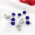 Silver and blue zodiac alloy pendants with rhinestones on white fabric background - Antique Silver September - Royal Blue