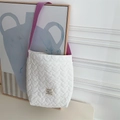 Detail of white quilted tote bag featuring purple strap and heart stitch pattern - White Heart