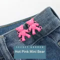 Rose red mini bear waist adjusters for jeans showing the cinch effect on blue denim - Hand-sewn Bear / Rose Red