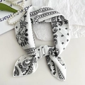 Elegant white square neck scarf featuring classic black paisley patterns and floral design - White Paisley
