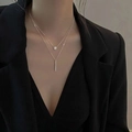 Elegant silver double-layer necklace with round diamond and bar pendants on a model - Layered Geometric Necklace