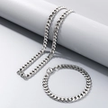 Polished silver stainless steel Cuban chain set including necklace and bracelet on stand - 7mm Steel / Bracelet 20CM