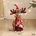 Élan de Noël debout avec salopette à carreaux rouges et skis, décoration de 38cm de haut - Petit Renne à Salopette