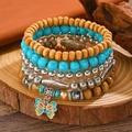 Detail of bohemian stretch bracelets with turquoise, wood beads and butterfly charm - Butterfly Rainbow Mix (K-553)