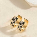 Detail of gold hoop earrings with black and white checkerboard pattern and zircon stones - Black Zirconia C-Shape