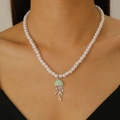 Pearl necklace with silver jellyfish pendant and rhinestones worn on a female model - Mint Green Jellyfish (7489)