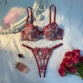 Flat lay of sheer floral embroidery lingerie set in deep red and pink with roses - Burgundy