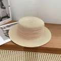 Elegant beige flat top straw boater hat with decorative ribbon on a wooden table - M / Beige With Beige Ribbon