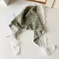 Detail of green floral triangle headscarf with white lace trim on a white background - Small Floral Lace / Green