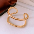Macro shot of double-layer gold open bangle with zircon on velvet display stand - Gold Double Layer Curve Style