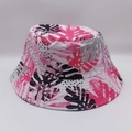 Close-up detail of the pink and black tropical palm leaf print on the fabric bucket hat - Pink White Black Palm Leaves