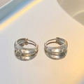 Polished silver metal hoop earrings shown with elegant mirror reflection and minimalist style - Minimalist Silver Hoop