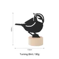 Black iron silhouette of a bird looking back on a natural wooden base 14cm height - Looking Back Bird Style / Black