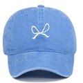 Close-up of blue washed cotton baseball cap featuring detailed white embroidered bow design - Adjustable / Light Blue