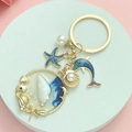 Golden ocean keychain with dolphin, starfish and resin sea wave pendant in summer style - Enamel Blue Marine Bio Style