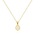 Detailed macro of gold oval pendant featuring a white center with the letter M - Letter M