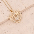 Macro shot of gold-plated MM heart pendant with shimmering cubic zirconia inlay - Heart MM Double Heart Style(6#)