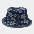 Close-up of floral jacquard pattern and frayed edges on denim bucket hat fabric - One Size / Dark Blue
