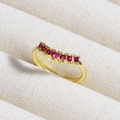 Macro shot of gold ring with seven red gemstones on beige fabric background - Seven Red Stones Crown Row (款式14)